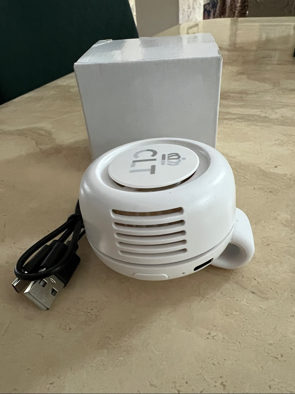 Portable mini bladeless clip-on fan worn on a waistband or clipped to clothing